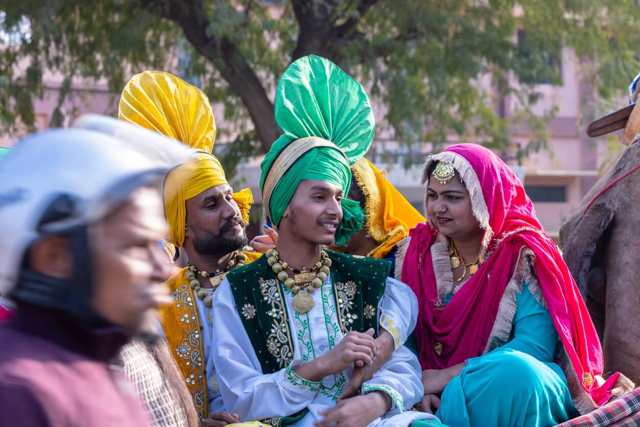 Group of people dressed in typical Indian costumes